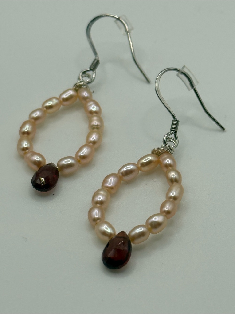 Delicate Champagne Pearl Loop Earrings with Garnet Teardrop